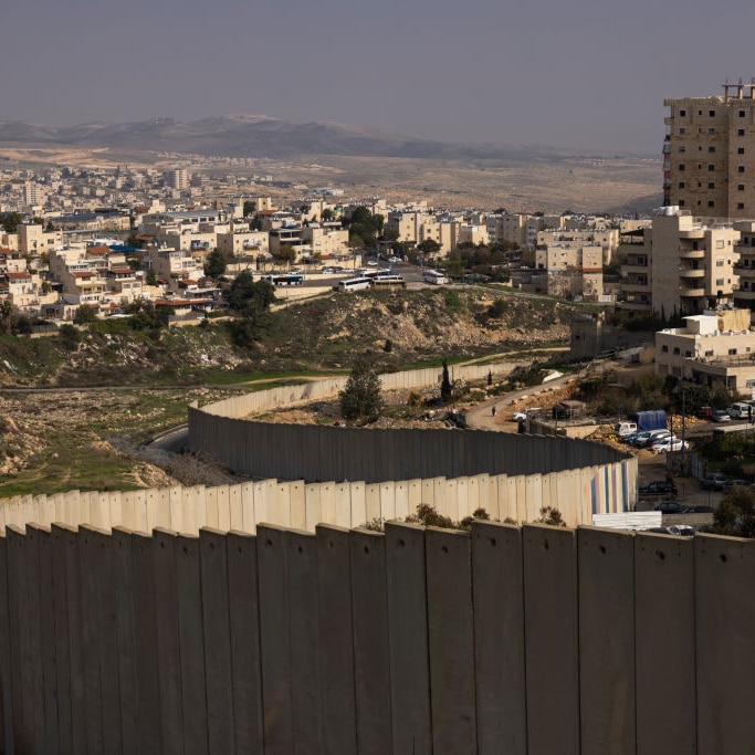 A winding wall surrounding a Palestinian neighbourhood