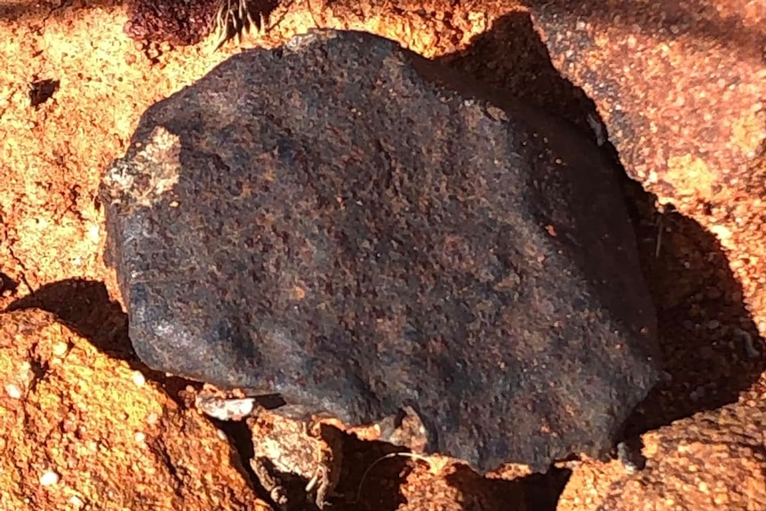 A large black rock