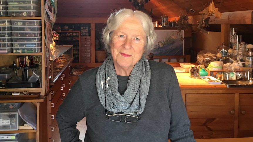 Annemeike Mein inside her kitchen, artwork and cotton in the background