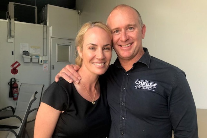 Sam Penny and Helen Shadforth smile at the camera.