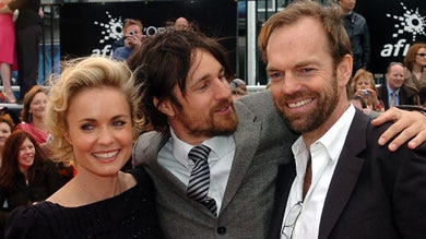 Radha Mitchell (l) Martin Henderson (c) and Hugo Weaving make their way down the red carpet