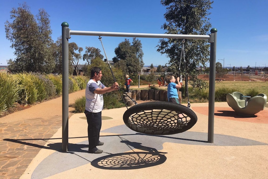 Larry Jarred and his sons Charlie 6, and Kane, 3 at a playground near Melton.