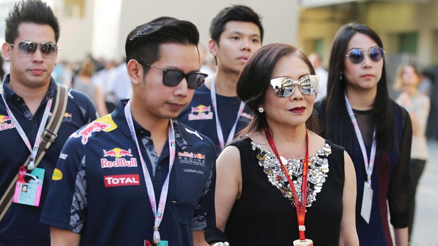 Family in Red Bull merchandise walks in crowd