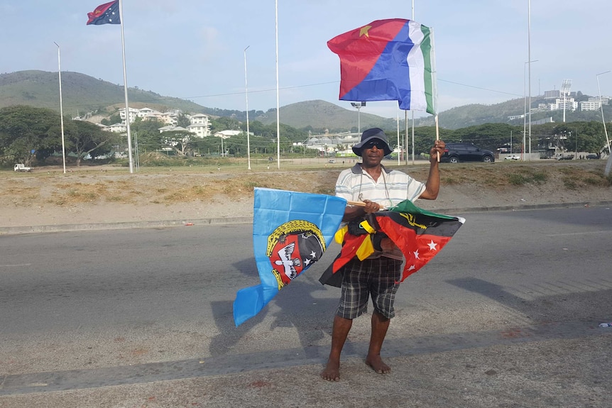 PNG Independence Day man selling flags