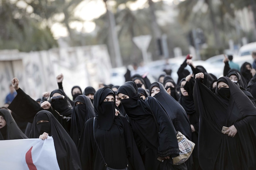 Bahraini women take part in a protest in the village of Jidhafs