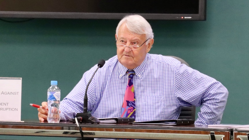 Ken Fleming sitting at a desk during NT Parliament estimates.