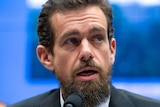 Twitter chief executive Jack Dorsey in front of a microphone