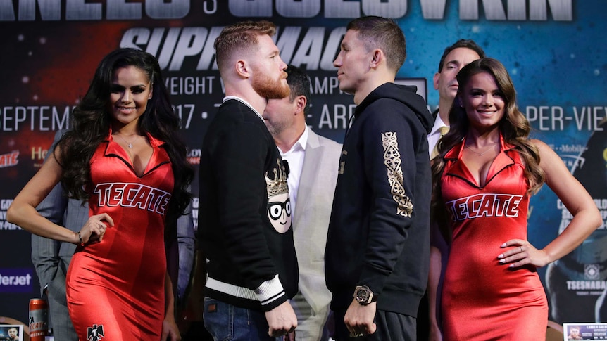 Boxers Canelo Alvarez and Gennady Golovkin face to face on stage.