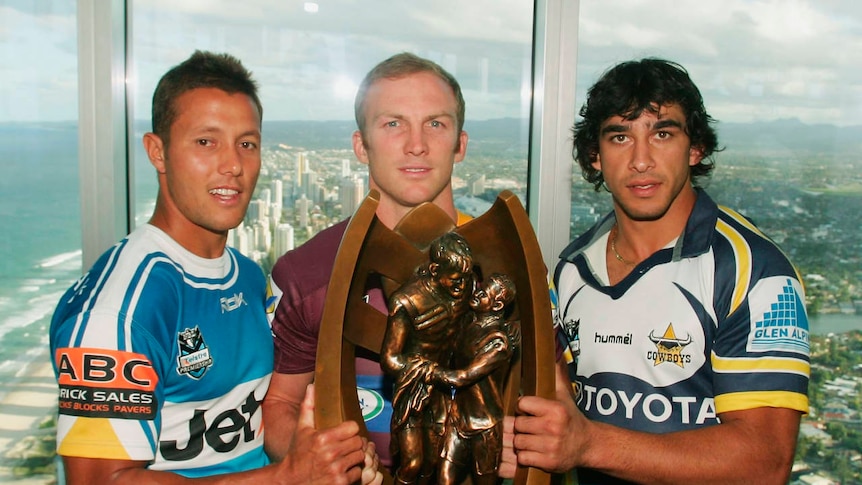 Eyes on the prize ... Scott Prince, Darren Lockyer and Johnathan Thurston pose with the NRL trophy