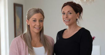 Two women in their apartment.