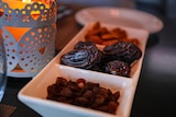An assortment of dates in a tray.