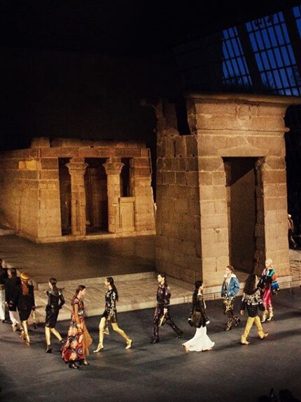 Chanel models walk past an Egyptian-themed set in New York.