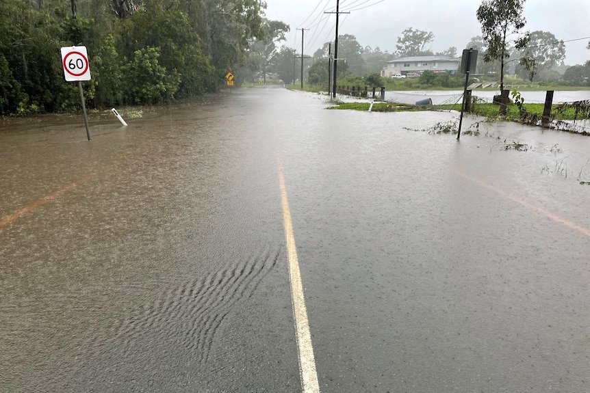 Water covers a road.