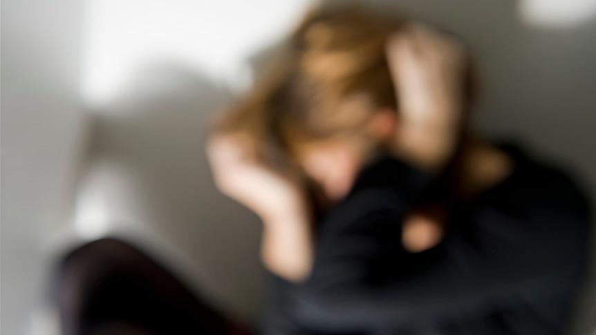 Blurred image of a person in a moving pose