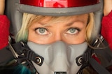 Jessi Combs dons a helmet and mask