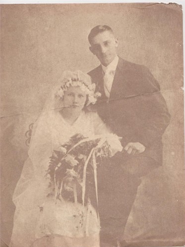 A faded black and white wedding photograph