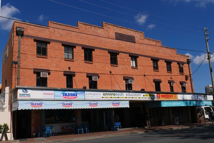 Red brick building with shops