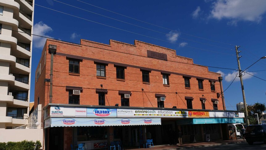 Red brick building with shops