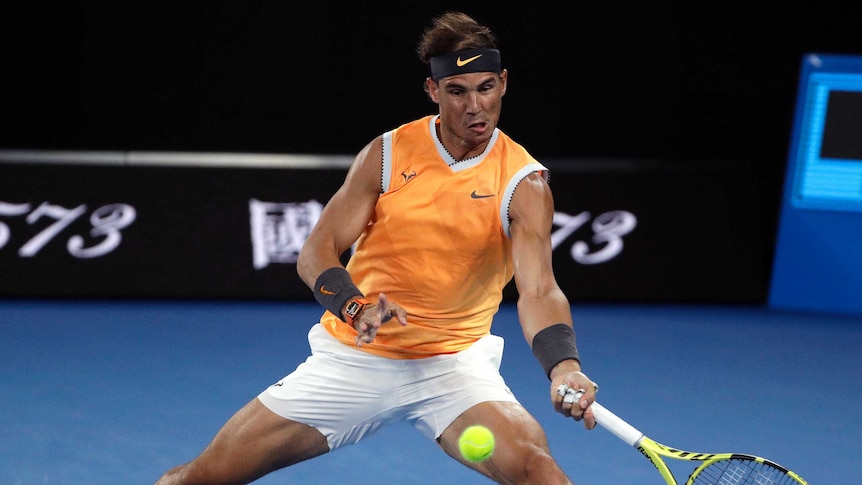 Rafael Nadal scrambles a shot off the baseline against Matt Ebden at the Australian Open