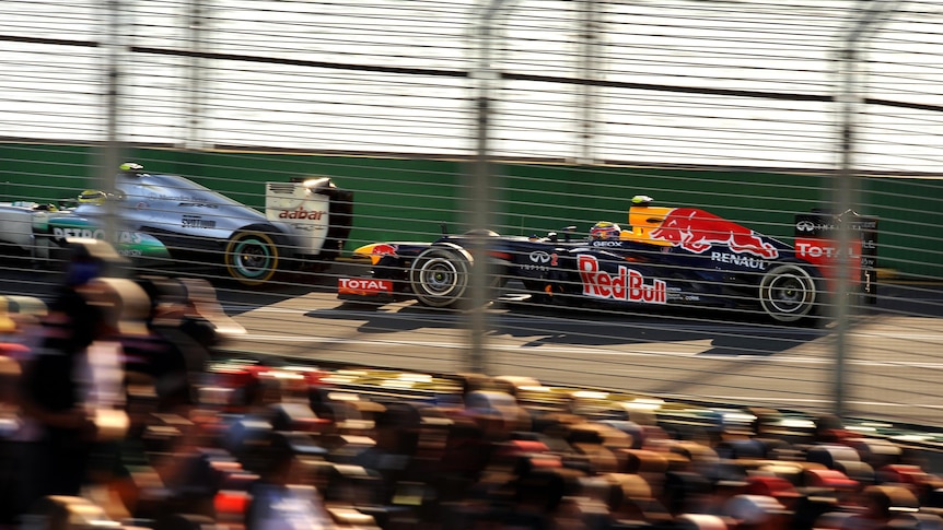 Mark Webber speeds past the crowd during last year's Australian F1 Grand Prix.