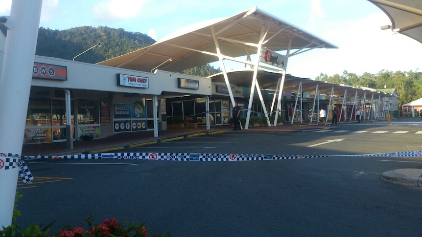 Police guard Cannonvale Shopping Centre following a fire the night prior