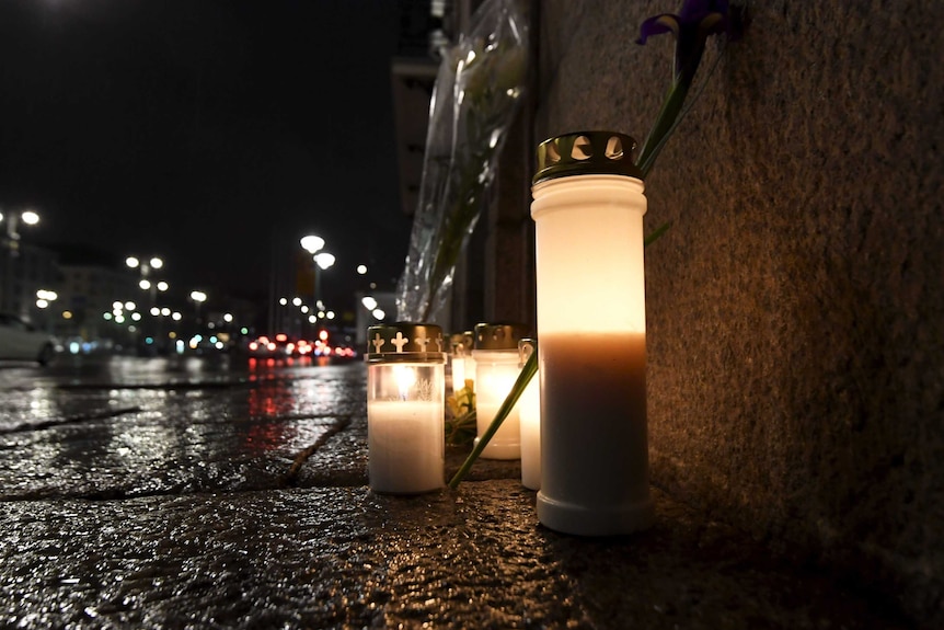 Memorial candles outside the Swedish Embassy in Helsinki.