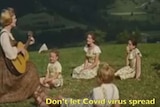 A screengrab from the 1965 musical The Sound of Musical showing a woman singing to a group of children in the Austrian alps.
