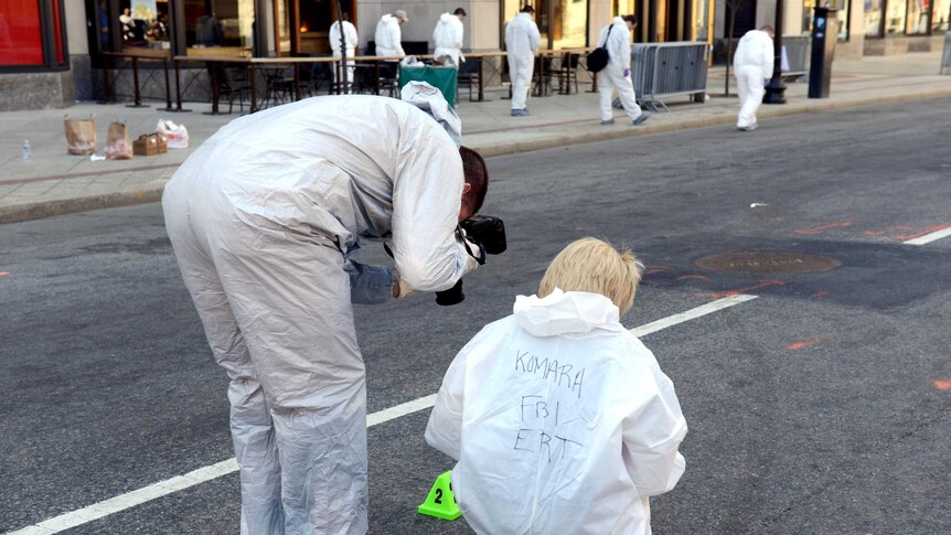 FBI crime scene investigators photograph evidence in Boston.