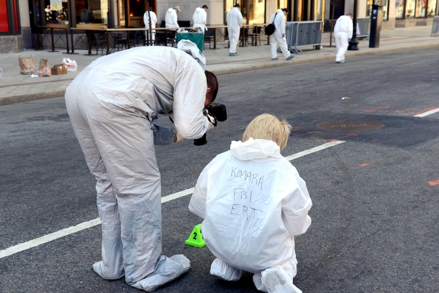 FBI crime scene investigators photograph evidence in Boston.