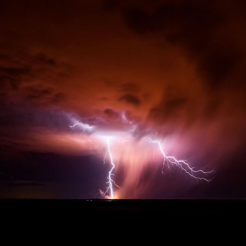 Lightning lights up a night sky