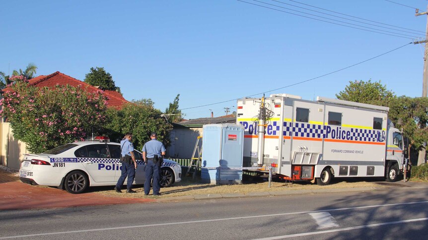 Police outside a Kewdale house where a man was arrested yesterday.