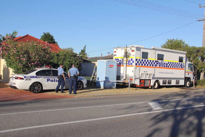 Police outside a Kewdale house where a man was arrested yesterday.