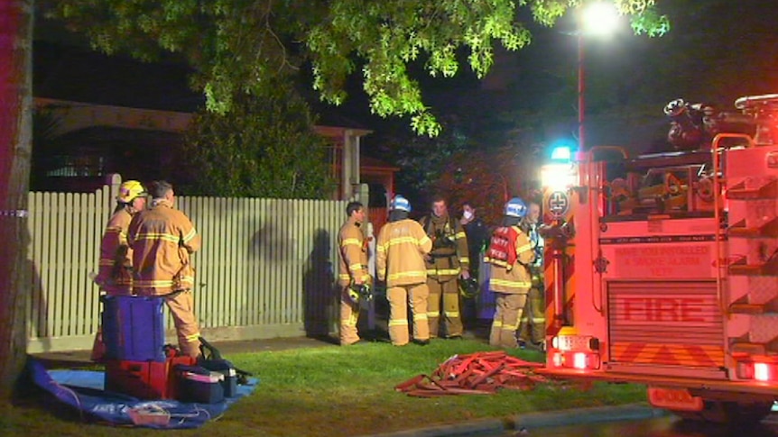 Fire crews at the scene of a fatal house fire at Camberwell.