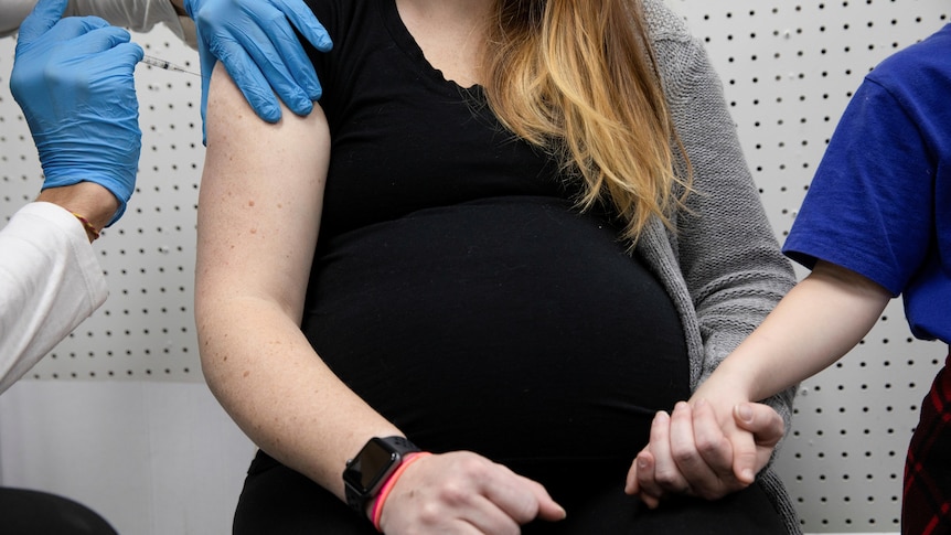 A pregnant woman receives her COVID-19 shot in Pennsylvania, January 2021.