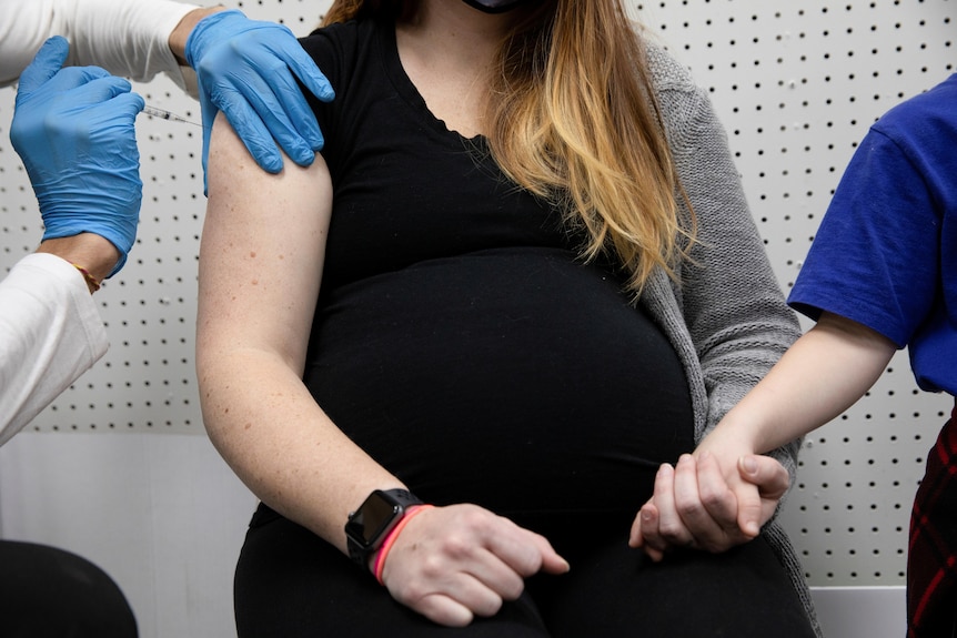 A pregnant woman receives her COVID-19 vaccine in Pennsylvania, January 2021.