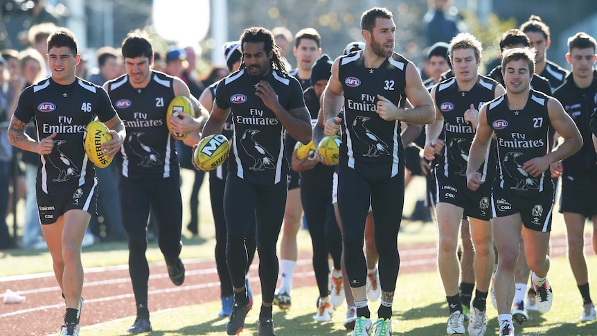 Harry O'Brien runs during Collingwood training on July 9, 2013.