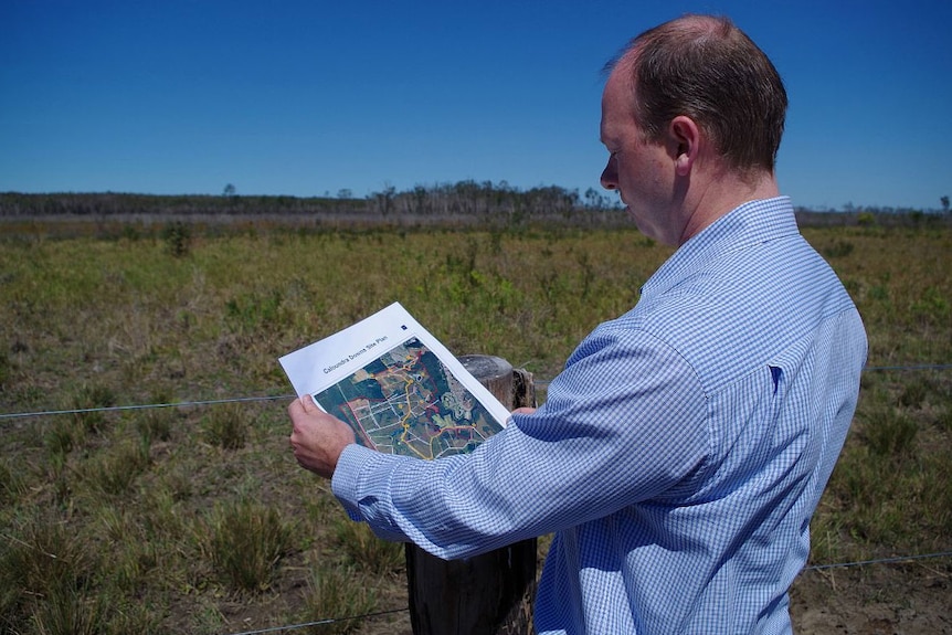 Stockland project manager Adrian Allen shows a plan of the Halls Creek housing development on the site, south of Caloundra