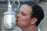 Zach Johnson holds the Claret Jug after winning the British Open