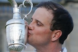 Zach Johnson holds the Claret Jug after winning the British Open
