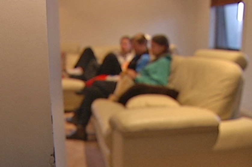 Blurred image of young people sitting on a lounge chair