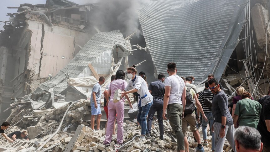 Rescuers dig through rubble in hospital