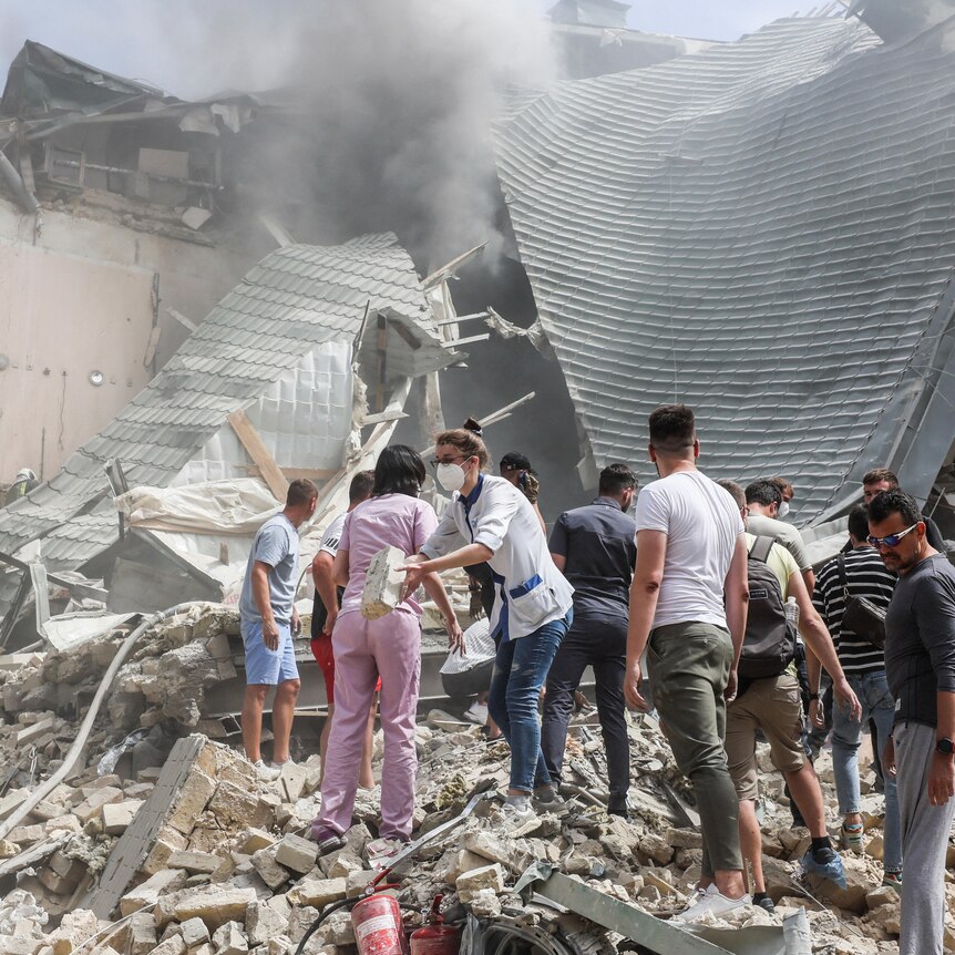 Rescuers dig through rubble in hospital