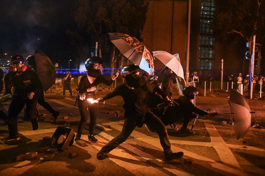 A protestor throws a petrol bomb during protests in Hong Kong.