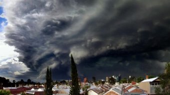 Dark, ominous clouds roll over suburban houses