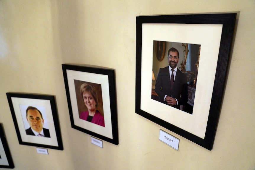 Photo frames on a wall with the first a portrait of Humza Yousad and the second of Nicola Sturgeon