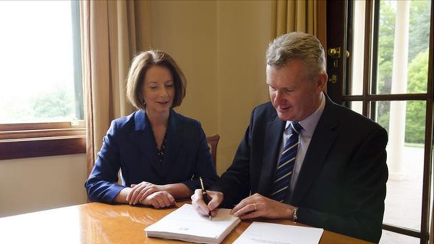 Federal Water Minister Tony Burke signs the Basin Plan into law