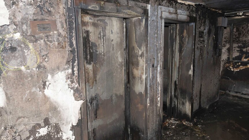 A photo shows the elevators in Grenfell Towers completely burned and covered in ash.