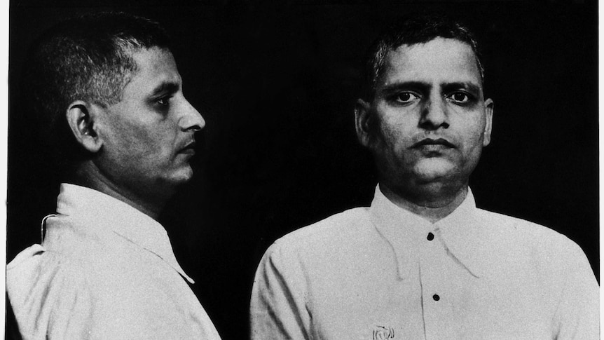 black and white mug shots of Nathuram Godse in button up shirt, one side profile, one front on