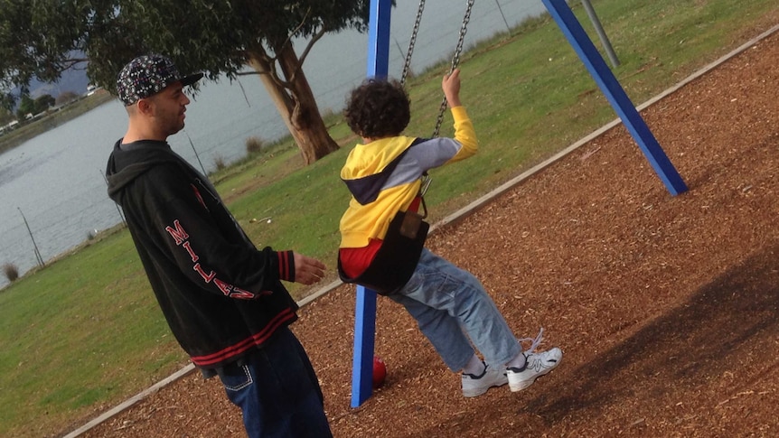 Single father Selvin Aragon plays with his son.