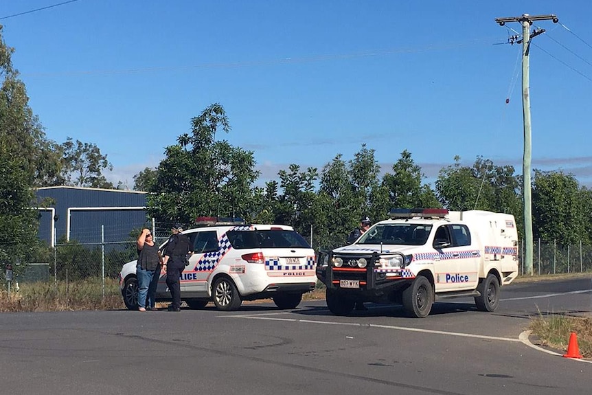 Resident speaks to police at road block in exclusion zone where gunman siege continues